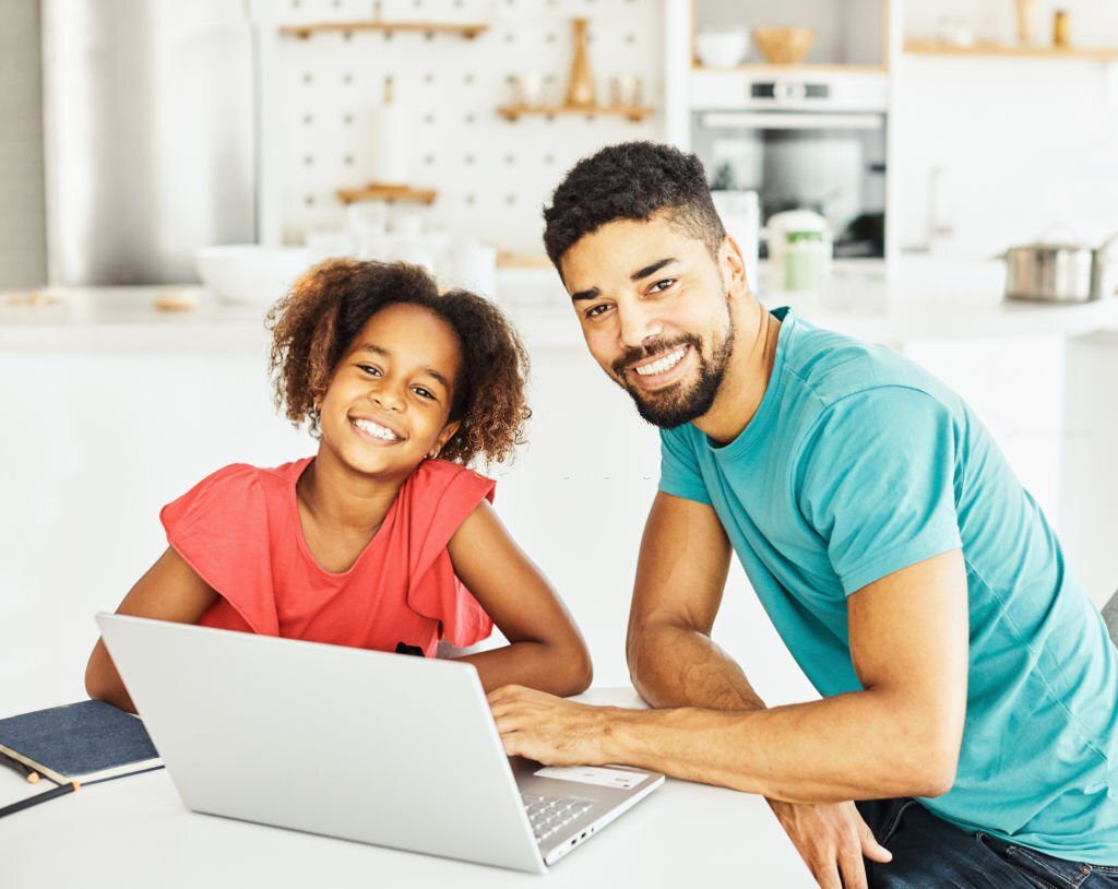 father and daughter having fun doing homework with laptop at home Chislehurst, late transfer test tutors in Chislehurst, late transfer test in Chislehurst, late transfer test tutor in Chislehurst, Year 8 transfer test in Chislehurst, Year 9 transfer test in Chislehurst, tuition